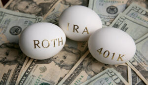 Image of three eggs with the words: Roth, IRA, and 401K sitting on top of US currency
Rolling Over a 401(k) into an IRA